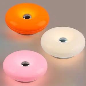 1-piece rechargeable donut bedside wall lamp made of ABS material, with three color ambient light that can be used as both a wall lamp and a table/floor lamp. Suitable for bedrooms, living rooms, sofas, bedside lamps, and ambient lighting