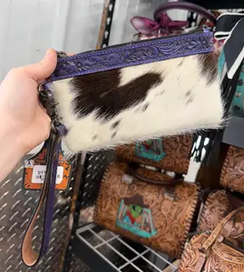 Genuine cowhide wristlet pouch with tooled detailing