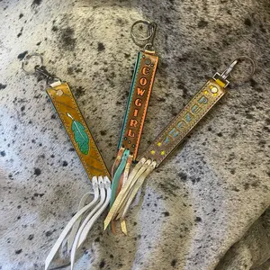 Hand tooled, hand painted, wristlet key fobs