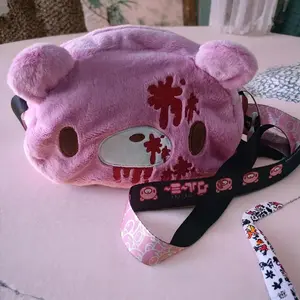 Gloomy Bear plush crossbody bag: Pink, cute - edgy with “blood - splatter” details. A fun, unique pick for fans.