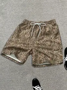 Men's grass camouflage printed drawstring shorts, full grass pattern silk screen printed clothing, loose fit with pockets, ideal for outdoor activities, daily wear, and gym workouts, durable and bold prints for outdoor and fashion enthusiasts