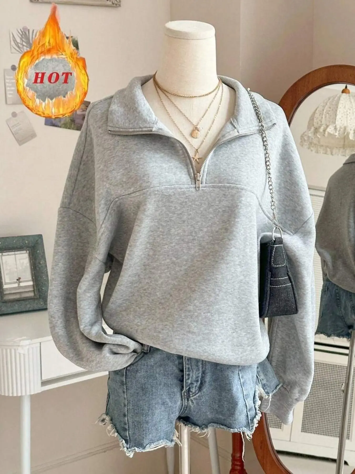 A solid-color zipper half-opening off-the-shoulder loose hoodie for women, a long-sleeved grey pullover sweatshirt for casual daily wear in spring and autumn. It's the season for students to wear and return to school