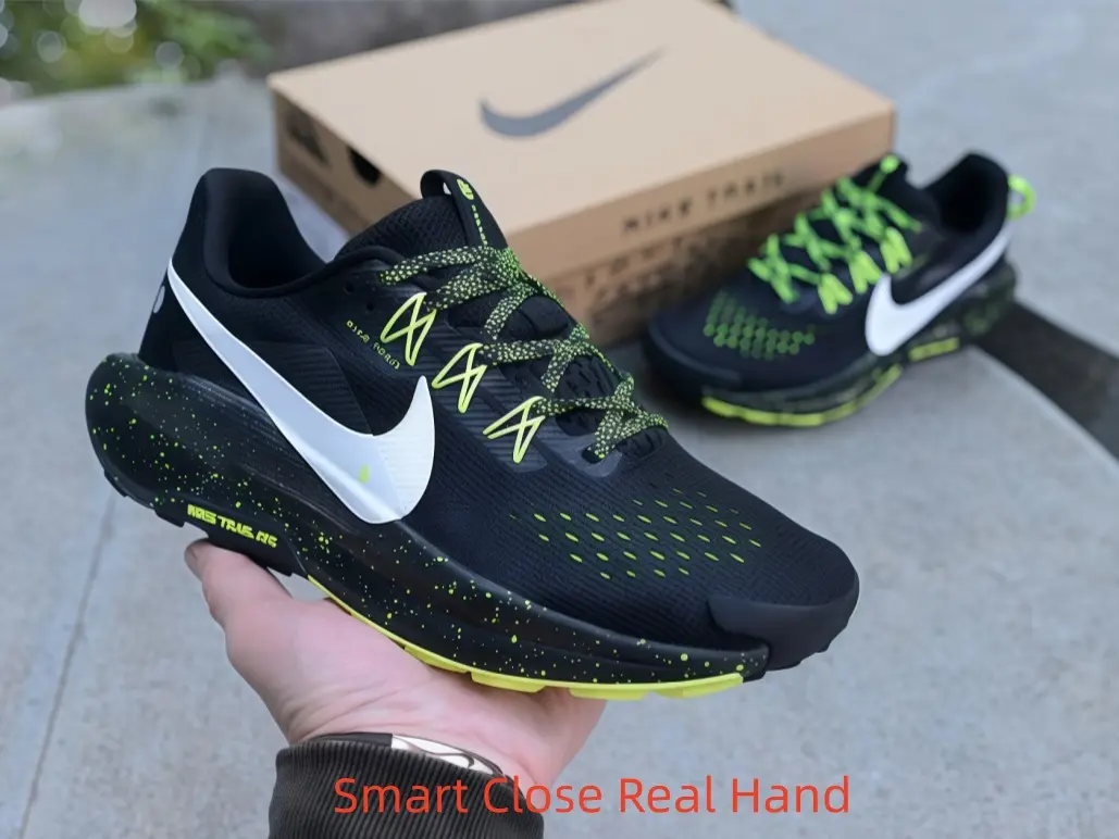 Matte black low-top collectible sneakers, perforated rugged mesh with neon lime speckled midsole detailing
