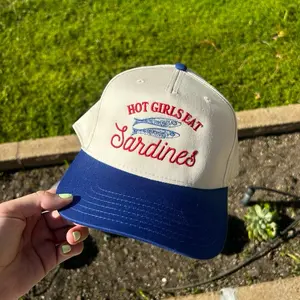 Hot girls eat sardines trucker hat