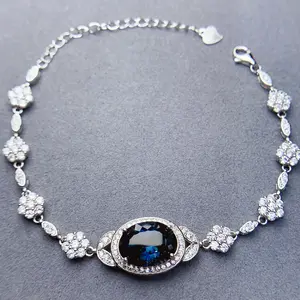 Cody Crystal Topaz Bracelet with Elegant Blue Gemstone and Sparkling Floral Design
