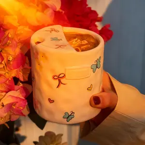 Hand-pinched irregularly painted bow-shaped handheld mug - minimalist ceramic mug with filter-brand new washable cute mugs for coffee lovers-coffee mug gift-reusable ceramic coffee mug-suitable for home,office,travel,leisure,breakfast,couple mug Drinkware