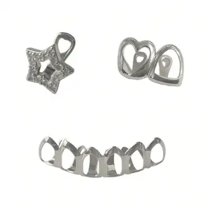 Bottom open-face silver grillz paired with a top single-tooth star and heart grillz. Made with durable silver-plated metal, they come with adjustable molding bars for a secure, comfortable fit on most teeth sizes.