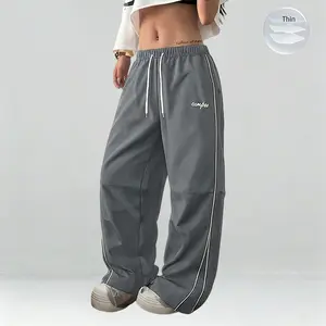 Women’s lightweight summer sports pants—thin, soft, and loose in large sizes! Sweeping pants — casual long pants with gray side stripes and gold decorative stripes, comfortable design, sports-casual style bottoms, gym wear, street dance outfit