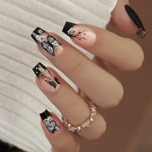CurvLife Noir Papillon Butterfly Press-On Nails — Long Square tips in black-to-nude ombre with delicate butterfly and floral linework plus 3D pearl accents; non-toxic, durable, and reusable; quick application for chic party or everyday elegance.