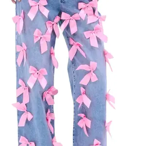 Women's Bow Pants with Pink Bows and Distressed Design Featuring a Matching Pink Purse