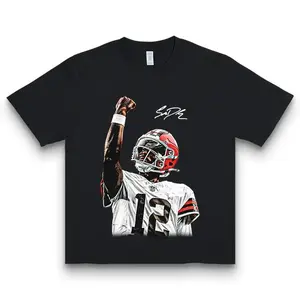 Shedeur Sanders T-Shirt – Celly Character Print, 100%25 Cotton, Comfortable Fit for Sports Fans