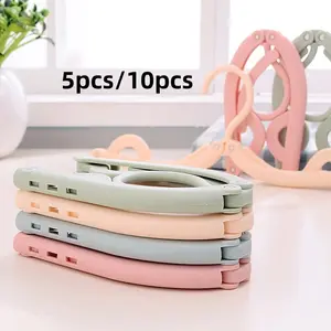 10-piece foldable portable clothes hanger, space-saving, multi-functional hanger, essential for travel, home storage organizer, suitable for business trips, vacations, and daily use