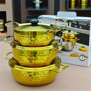 Gold stainless steel noodle pot with lid. Durable non-stick, dishwasher safe, textured base for even heating. Ideal for home, camping, parties, restaurant. Elegant gold finish, modern kitchen essential