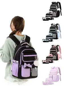 Sweet academic-style girls' backpack, featuring a large-capacity multi-compartment design, detachable bow and pom-pom keychain decorations, lightweight and portable ergonomic straps, combining stylish appearance with spine protection and weight reduction.