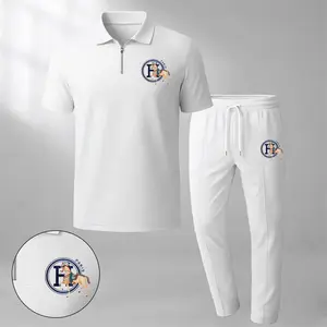 Men's two-piece set features a short-sleeve zip-collar polo shirt and matching trousers. Crafted from breathable, soft-textured waffle-knit fabric, it offers a comfortable, relaxed fit ideal for everyday casual wear.
