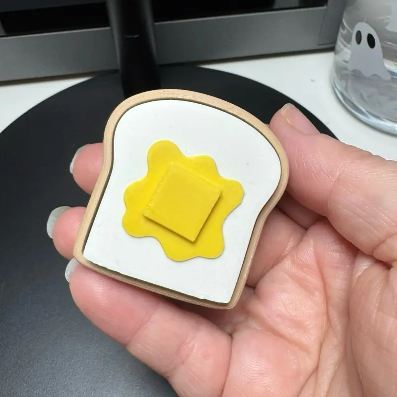 Melted Butter Toast Fidget Clicker – Adult Anxiety Collectible – Stress Relief Tool