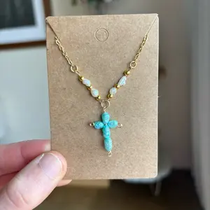 Blue Pearl Cross Necklace with White Pearl Details