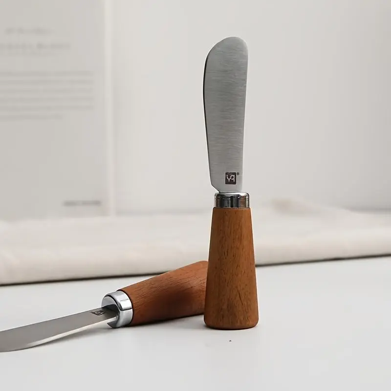 1pc of a Stainless Steel Multifunctional Butter Knife Featuring a Wooden Handle, Ideal for Spreading Cream, Cheese, Jam, And Peanut Butter