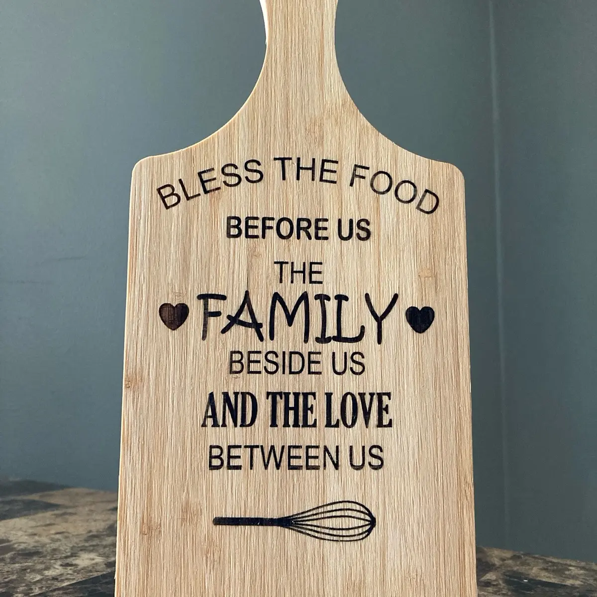 Laser engraved kitchen cutting board for decoration.