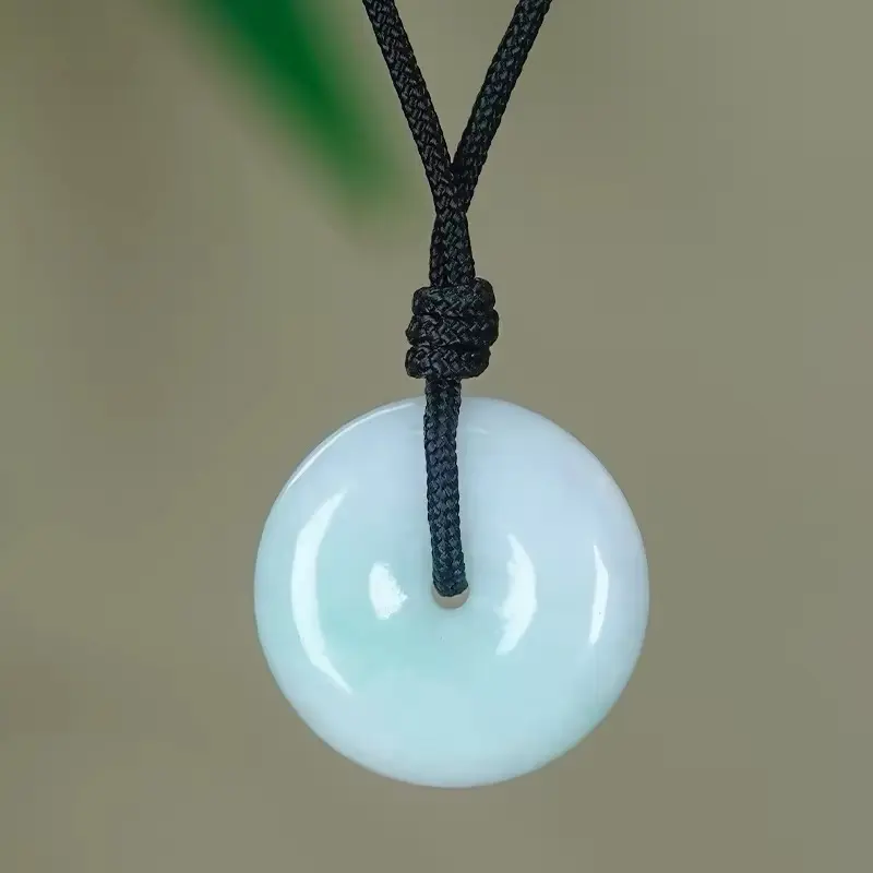 Genuine Type A Natural Jadeite Donut Pendant. Icy translucent texture, a symbol of peace and prosperity. Certified quality.