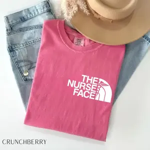 Comfort Colors The Nurse Face T-Shirt, a nurse appreciation and nurse life graphic tee, perfect for students, registered nurses, and healthcare heroes.