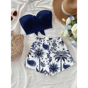 Women’s island vacation palm tree and sun god print crop top two-piece set, perfect for summer vacations and stylish spring looks GARMENTARY