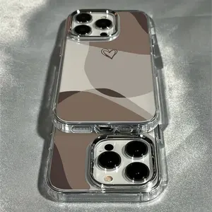 Phone case suitable for iPhone 17, 16 Pro Max, 15 Plus, 14, 13, 12 series. This trendy and creative luxury transparent brown heart-shaped phone case features an electroplated lens design
