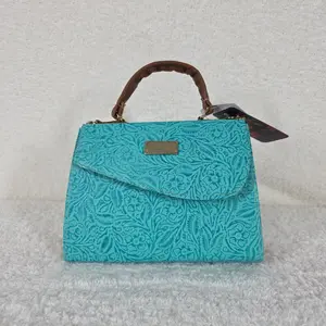 Handcrafted Turquoise Leather Crossbody Bag with Floral Embossed Design