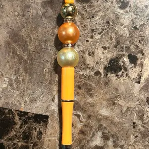 Cream Orange Beaded Pen with Yellow Body and Beads - Product Description Provided