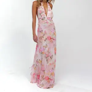 Women’s long sleeveless halter backless summer cocktail dress with floral/dot print — feminine light prom dress