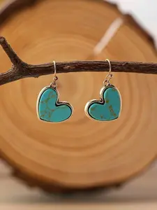 A pair of vintage bohemian-style natural turquoise heart-shaped earrings would be the perfect gift for mom on Valentine's Day or Mother's Day.