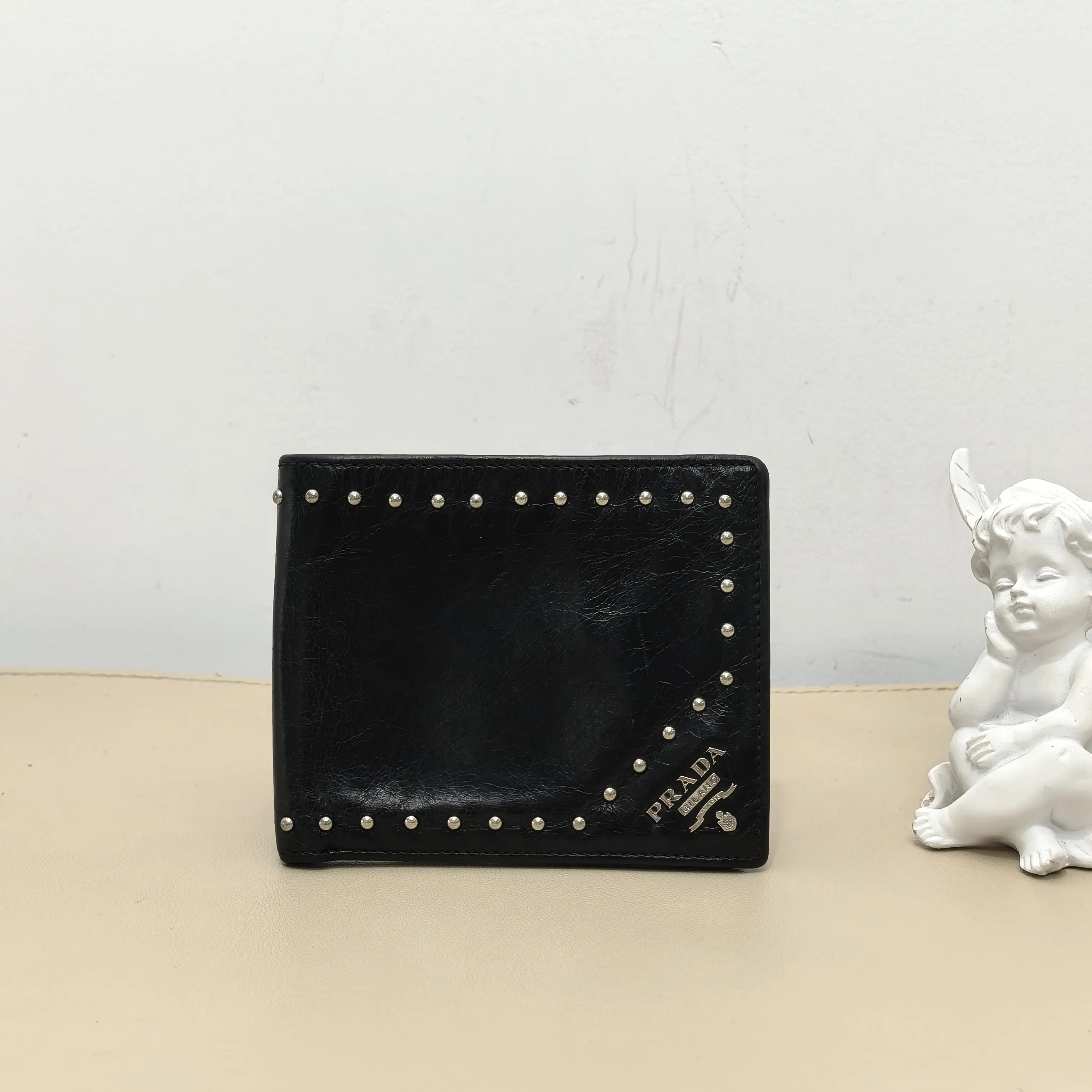 Pre-owned PRADA Calfskin Small Leather Goods Black Distressed Cracked Leather Studded Bifold Wallet B8062507