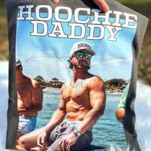 Hoochie Daddy Riley Green T-Shirt - Pepper Colored Comfort Colors Tee for Men Showcasing Hoochie Daddy Design