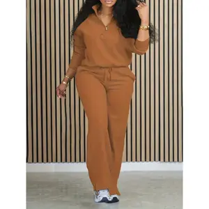 Two piece women's polyester and stretch vacation set, including top and bottom, small collar, drawstring pants and zipper, all season casual wear