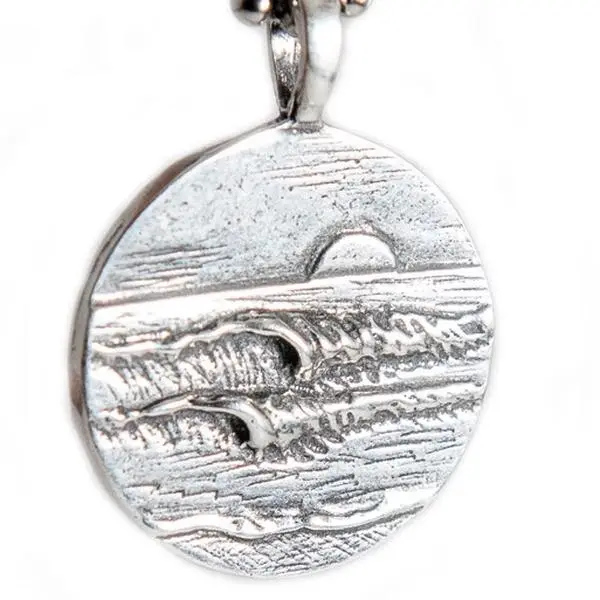 The Left and Right Pendant two sided by Strickly Boarding and Joe Paradise.  Made by surfers for surfers.  Kee the stoke with you always!