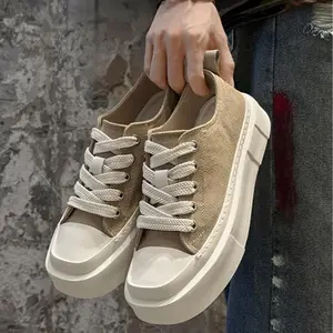 Men’s Square Toe Platform Canvas Sneakers. Classic black canvas upper matched with thick cream laces, square toe shape delivers modern trendy look. Chunky cream rubber platform sole offers subtle height boost,