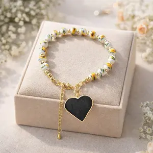 Handmade Floral Beaded Bracelet with Black Heart Charm – Gold Accent Adjustable Bracelet