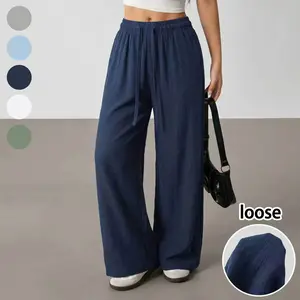 Women’s loose casual pants made from polyester fiber, comfortable and versatile, featuring a solid straight design with drawstring and pockets, suitable for everyday outings and outdoor activities.