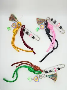 LOVE Heart Safety Pin Bag Charm - Beaded Clip with Tassel & Knotted Rope, Colorful Purse Charm, Large Metal Pin with Rainbow Heart Charm, Iridescent Tassel, Green Glass Bead, Fun Knotted Rope Accents