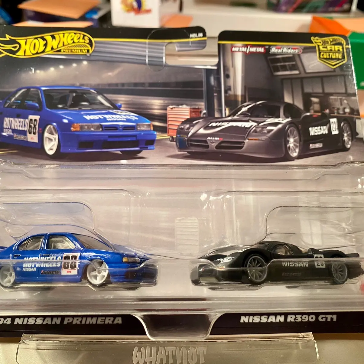 Hot Wheels Premium 2 Pack Nissan Set - Includes 2 Cars with Black & Blue Designs, Featuring Nissan Primera & R390 GTI Models