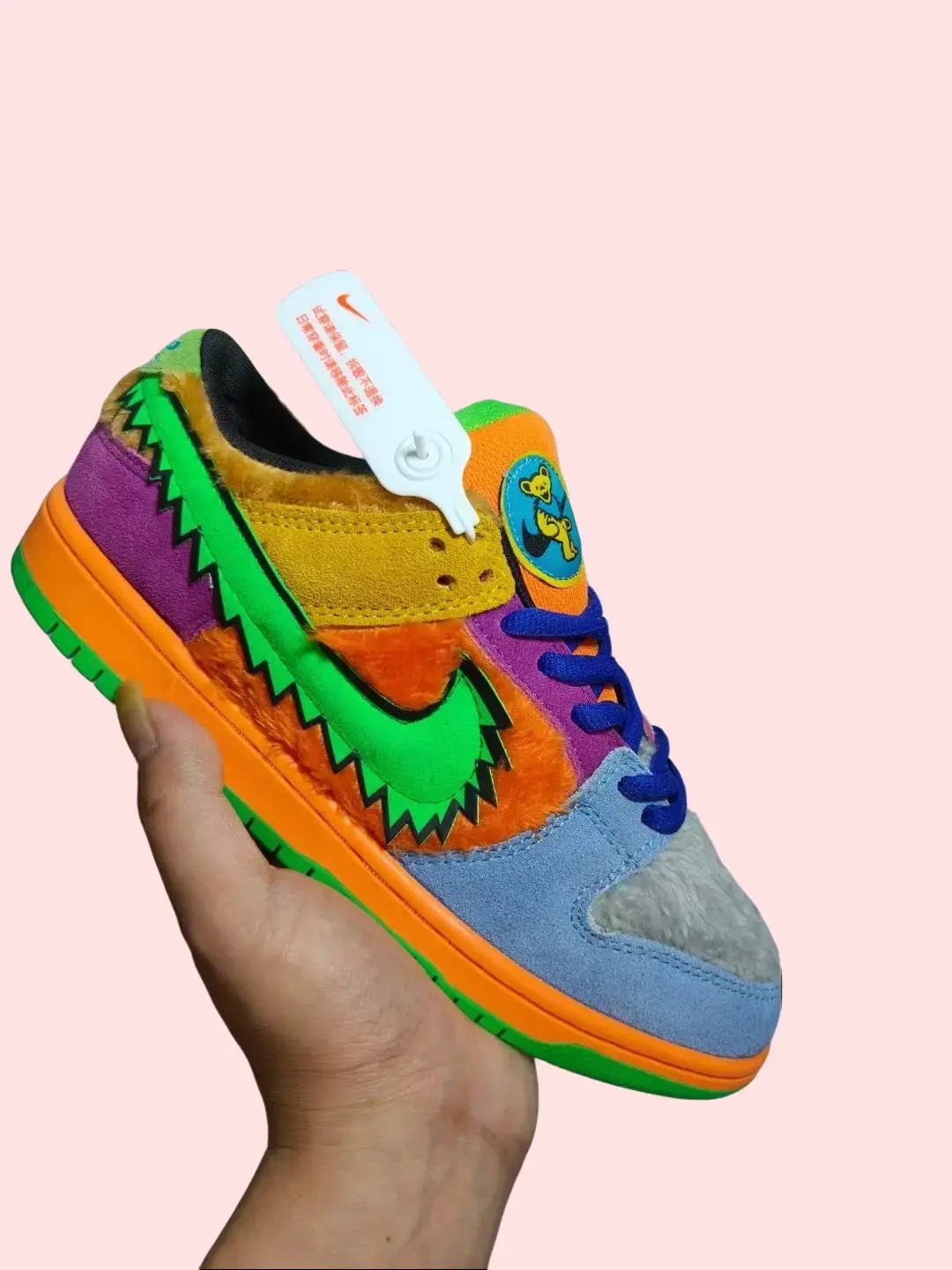 Retro casual sneakers soft suede and fuzzy textile, striking multi‑tone block coloring with bright orange midsole, flexible cushioned rubber outsole, elevates outfits with fun playful modern street fashion aesthetic