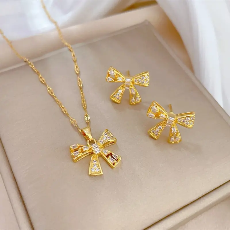 Elegant Gold Bow Necklace and Earrings Set with Sparkling Details Perfect for Special Occasions