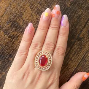 Gold plated Red adjustable Ring with multiple stones on it