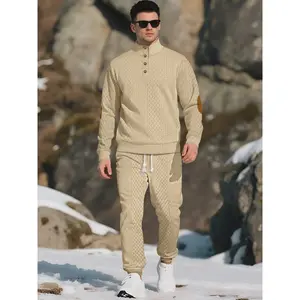 Men's knitted suit. The top features a half-placket and a high neckline, paired with simple and practical buttons. The brown elbow patches create a color contrast and match the drawstring jogger pants in the same color family. The fabric is thick.Gift