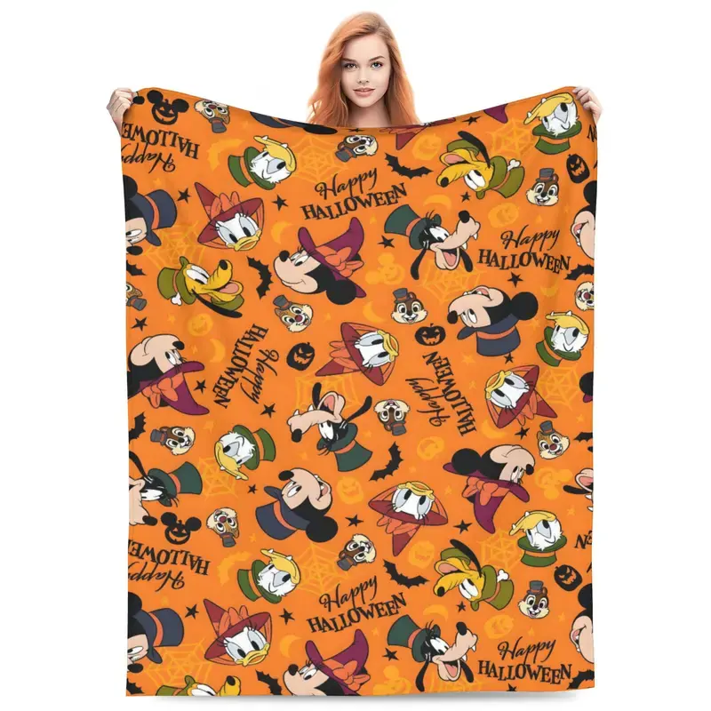 DISNEY CLASSIC Mickey Crew Halloween Flannel Blanket. Mickey, Minnie, Pluto and Donald in spooky costumes, all-over pumpkin & bat print. Soft cozy throw, seasonal gift for Disney Halloween fans
