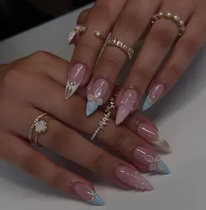 Bubble Nailart | Dreamy Pastel Butterfly Nails, nude pink tone with blue white French tips, 3D flower and butterfly charm, long almond handmade press on nails, reusable gel nail design 2025, high-gloss finish