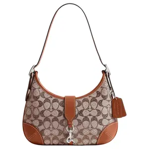 COACH Hamptons 27 Leather Hobo Bag with Adjustable Handle and Built-in Card Slot for Women in Polished Amber