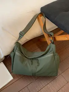 A casual, simple and practical shoulder bag with multiple zippered pockets and side drawstring design. It is a retro and fashionable versatile crossbody bag, suitable for daily commuting, shopping, and short distance travel Casual Commuter Bag