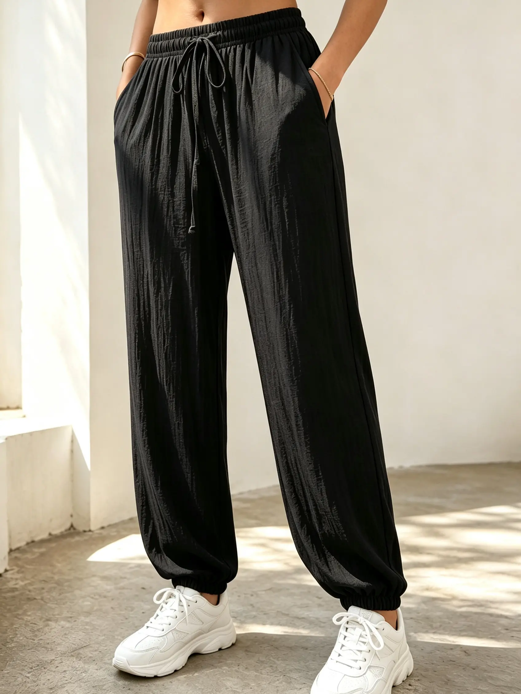 Women’s drawstring joggers with a linen texture and ruched detailing; essential for curvy women—high-stretch, loose jogger pants with side pockets, breathable and lightweight for summer casual beach workouts.