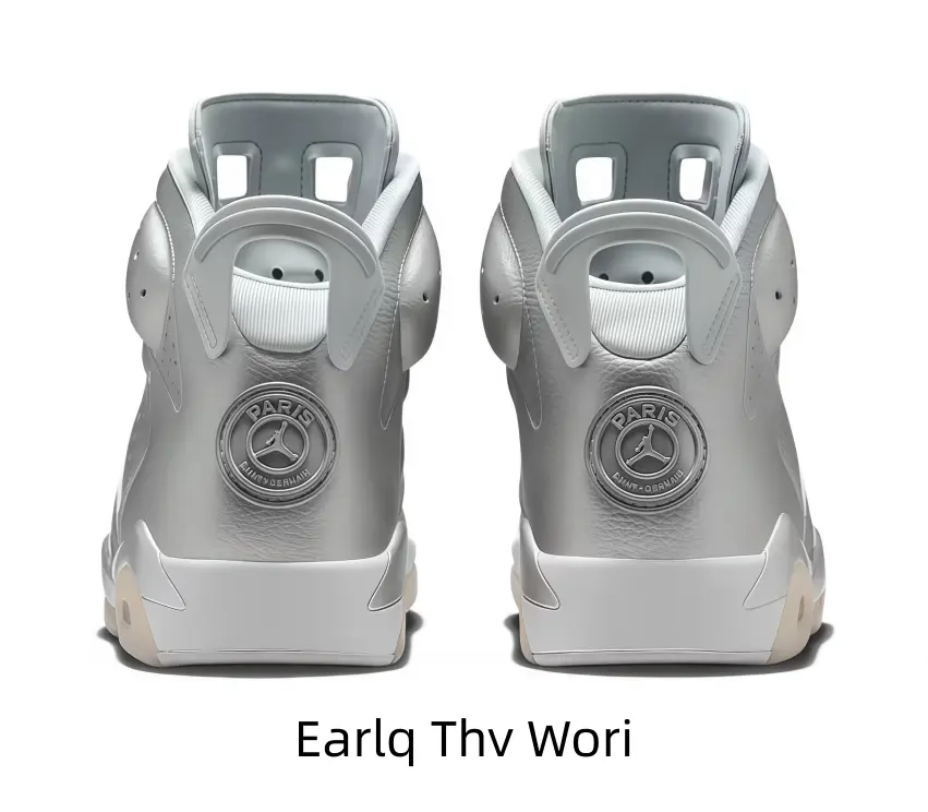 Premium metallic silver high-top athletic shoes with embossed circular rear emblem, padded ribbed inner ankle lining, matte white heel base and creamy beige traction sole tips.